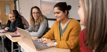 Social work students in class working together