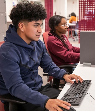 Two students working at computers