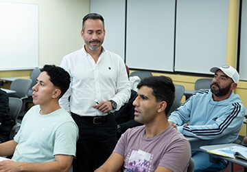 Jhon Cardona teaching students in an ESL class