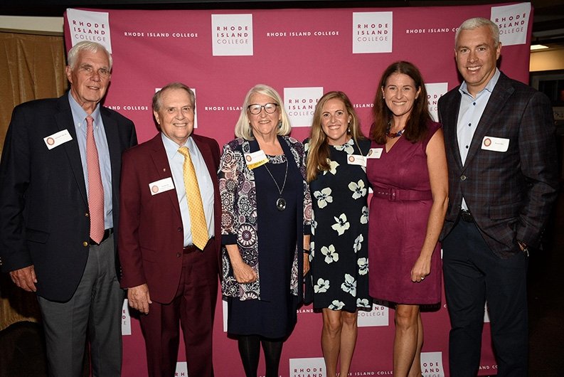 2024 Alumni Awardee Anne Sliney ‘87 with family and President Warner