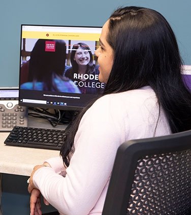 B.P.S. student at a computer