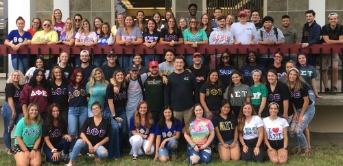Greek Life group photo in front of Adams Library